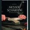 Messer schärfen mit dem Schleifstein.